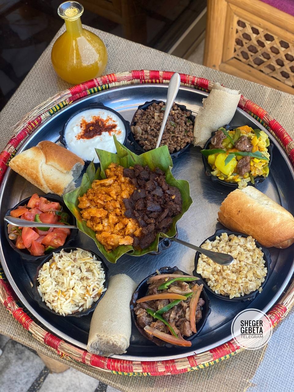 Authentic Ethiopian food platter with Injera and spicy Doro Wot chicken stew.